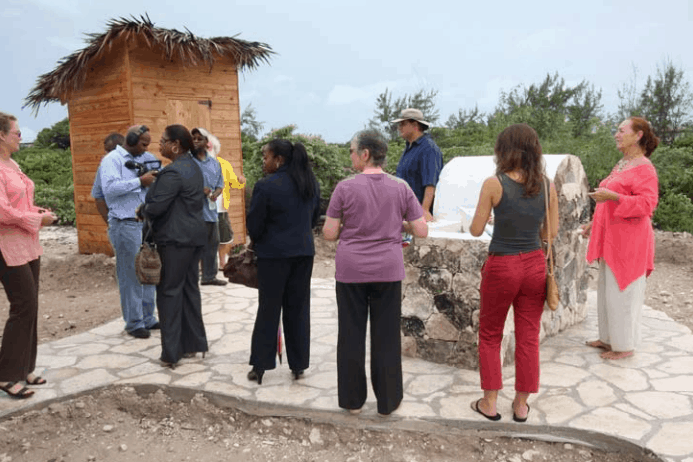 Caicos Heritage House, with the Museum Administrative building in the background to the left. The garden starts to the right of the picture; Copyright: RBC Royal Bank