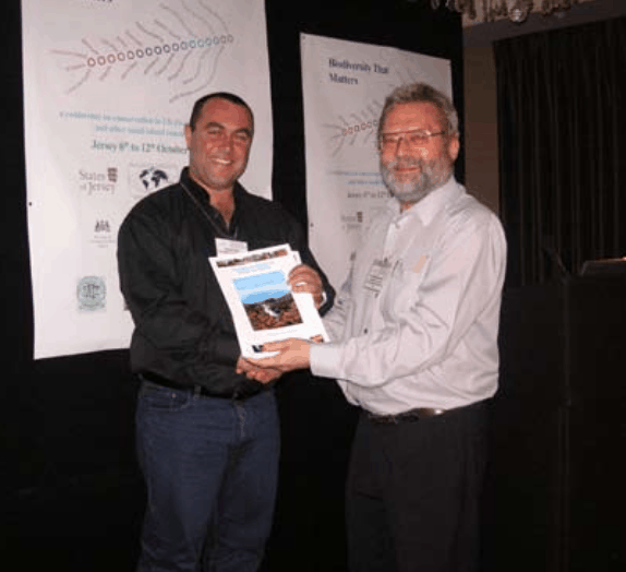 At the end of the Environmental Education session, UKOTCF Chairman, Dr Mike Pienkowski (right) presents the first copy of The Natural History of Tristan da Cunha to Simon Glass, Tristan da Cunha Conservation Officer. Funding secured by UKOTCF, for this work included a grant from the Bryan Guinness Charitable Trust