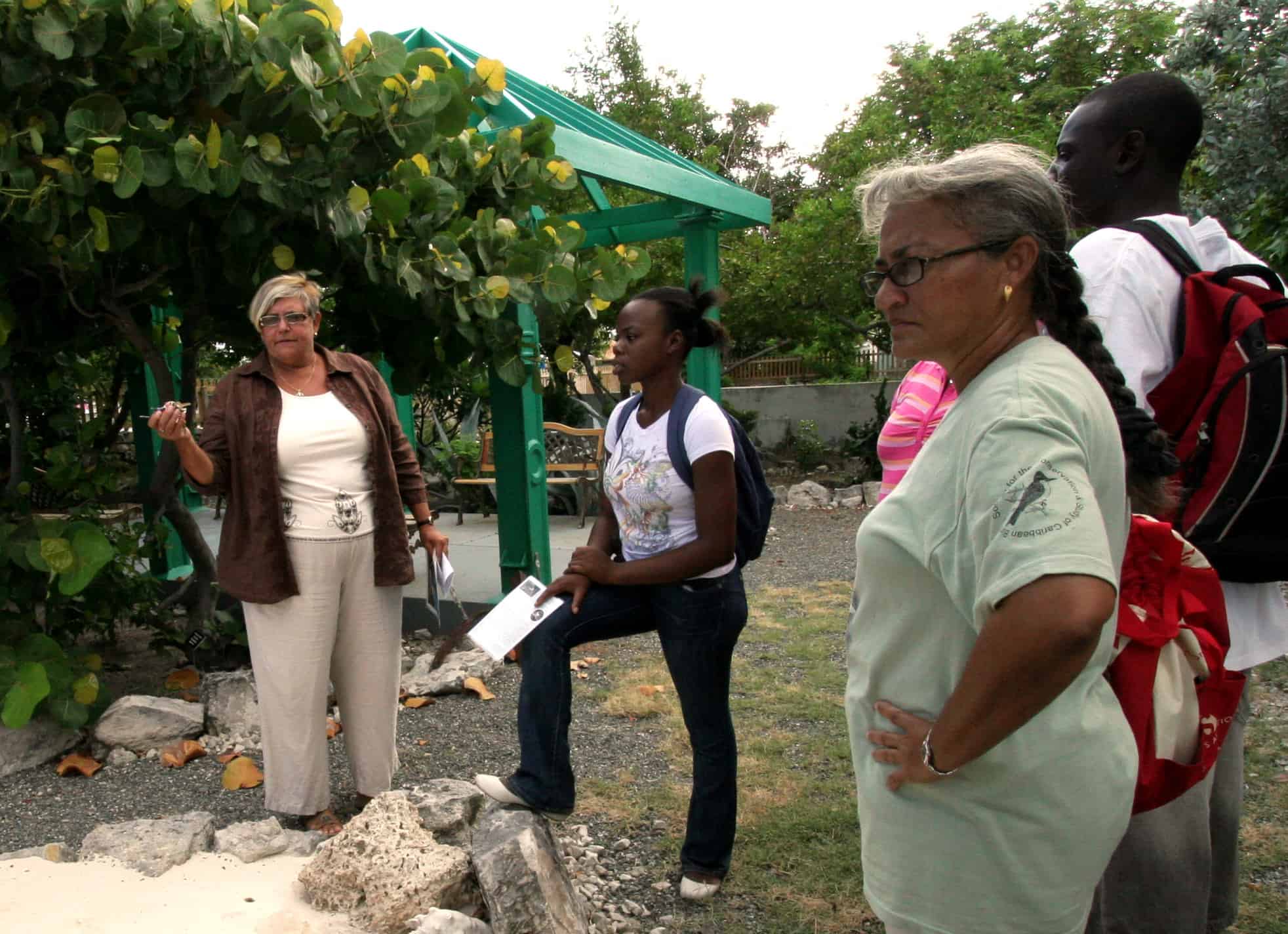 Museum Director, Pat Saxton shows a group around the TCI National Museum garden on Grand Turk; Copyright: Mike Pienkowski