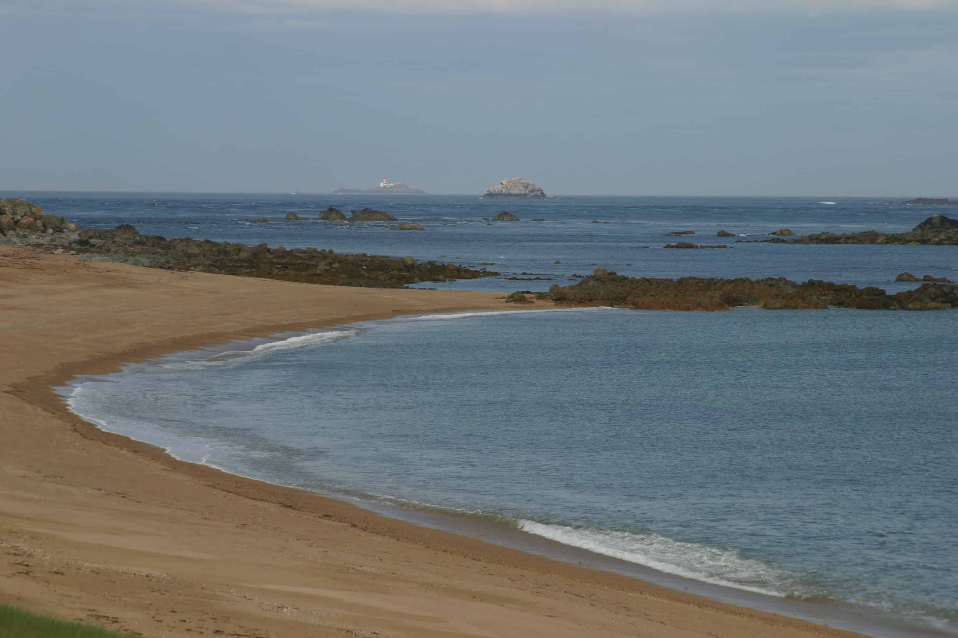 Looking westward from the mainland of Alderney, over the Ramsar Site, with some of the main seabird islands in the distance. Copyright: Dr Mike Pienkowski