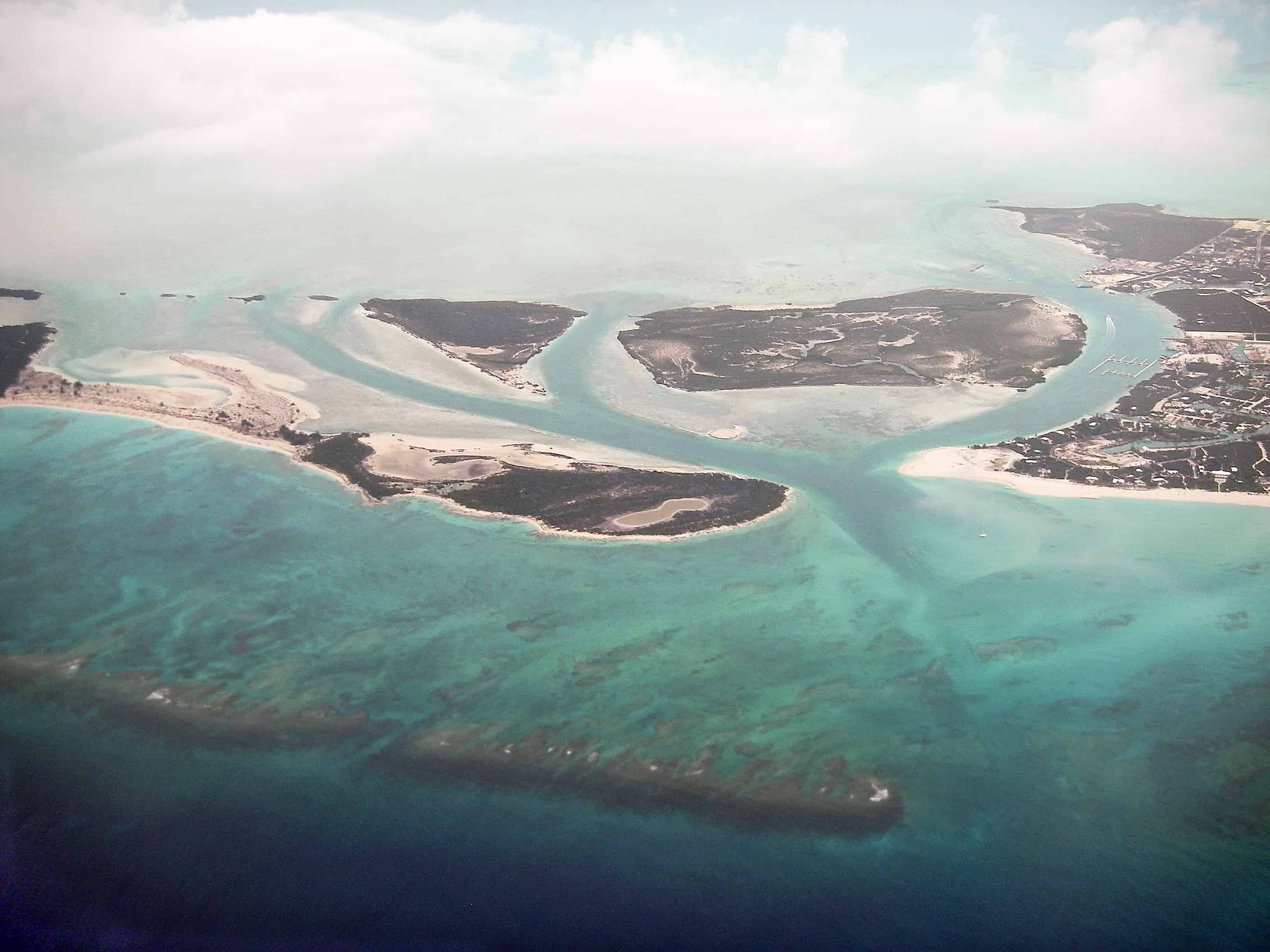 Water, Little Water, Donna and Mangrove Cays, the Leeward Wideopens Channel and fringing reef off the eastern end of Providenciales (to right). Copyright: Dr Mike Pienkowski