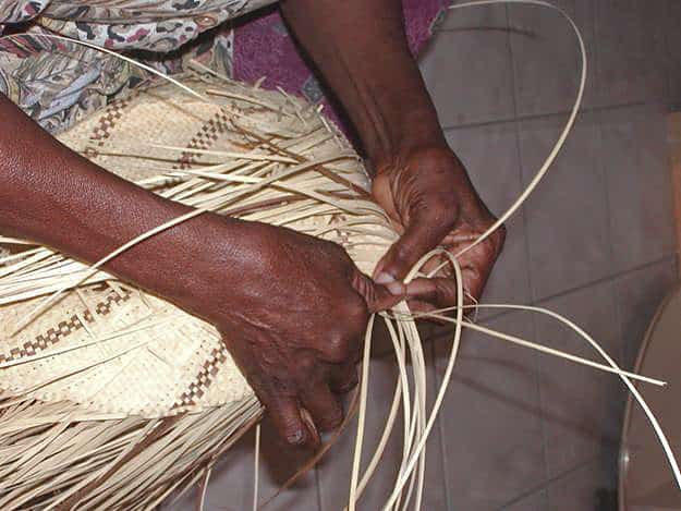 Basket making from local plant material, especially the native palms. Copyright: Dr Mike Pienkowski